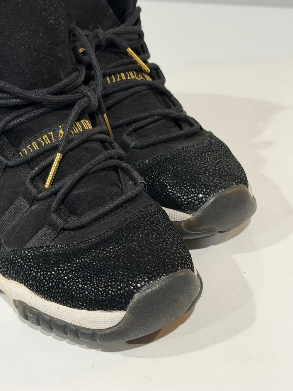 Jordan Black and Gold High-Top Sneakers
